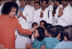 Swami blessing a small child